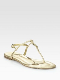 Crafted with an adjustable slingback strap and a rubber sole, this metallic leather flat has a goldtone designer emblem and classic thong front. Metallic leather upperLeather liningRubber solePadded insoleImportedOUR FIT MODEL RECOMMENDS ordering one half size down as this style runs large. Crafted with an adjustable slingback strap and a rubber sole, this metallic leather flat has a goldtone designer emblem and classic thong front. Metallic leather upperLeather liningRubber solePadded insoleImportedOUR FIT MODEL RECOMMENDS ordering one half size down as this style runs large.