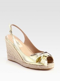 Adjustable, metallic leather slingback with an espadrille wedge and unique bow embellishment. Stacked rope wedge, 4 (100mm)Covered platform, 1 (25mm)Compares to a 3 heel (75mm)Leather upperLeather liningRubber solePadded insoleMade in ItalyOUR FIT MODEL RECOMMENDS ordering one half size up as this style runs small. Adjustable, metallic leather slingback with an espadrille wedge and unique bow embellishment. Stacked rope wedge, 4 (100mm)Covered platform, 1 (25mm)Compares to a 3 heel (75mm)Leather upperLeather liningRubber solePadded insoleMade in ItalyOUR FIT MODEL RECOMMENDS ordering one half size up as this style runs small.