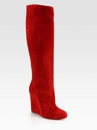 Tall silhouette of Italian suede with a sleek wedge heel. Self-covered wedge, 5 (125mm)Shaft, 20¼Leg circumference, 14¾Suede upperLeather lining and solePadded insoleMade in Italy Tall silhouette of Italian suede with a sleek wedge heel. Self-covered wedge, 5 (125mm)Shaft, 20¼Leg circumference, 14¾Suede upperLeather lining and solePadded insoleMade in Italy