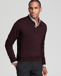 A classic polo design is rendered in uniquely soft merino wool for a plush addition to your sweater wardrobe. A classic polo design is rendered in uniquely soft merino wool for a plush addition to your sweater wardrobe.