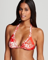 A beautiful floral print defines this brilliantly colored Nanette Lepore bikini top-it will lighten up your weekend bag since it reverses to a floral-on-white print for a bit of beachy variety. A beautiful floral print defines this brilliantly colored Nanette Lepore bikini top-it will lighten up your weekend bag since it reverses to a floral-on-white print for a bit of beachy variety.