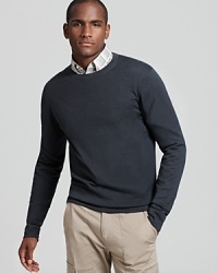 A classic crew neck sweater in a slim silhouette by Theory is rendered in a lush gray-blue. A classic crew neck sweater in a slim silhouette by Theory is rendered in a lush gray-blue.