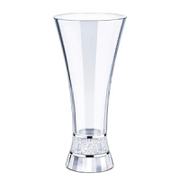Filled with hundreds of sparkling clear crystals, the crystalline center of this vase from Swarovski brings sparkling brilliance to your floral arrangement and elegance to any room. The sturdy base of faceted clear crystal adds an extra dimension of shine. Filled with hundreds of sparkling clear crystals, the crystalline center of this vase from Swarovski brings sparkling brilliance to your floral arrangement and elegance to any room. The sturdy base of faceted clear crystal adds an extra dimension of shine.