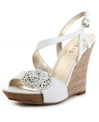 Always a lady. With a rosette detail and beautifully curved straps, the Latonia sandals by Guess are the season's most graceful wedge. Always a lady. With a rosette detail and beautifully curved straps, the Latonia sandals by Guess are the season's most graceful wedge.