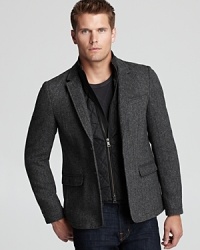 A trend-right look with a removable faux vest panel, this dapper sport coat hits the mark in classic herringbone. A trend-right look with a removable faux vest panel, this dapper sport coat hits the mark in classic herringbone.