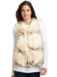 THE LOOKPlush dyed raccoon fur constructionHook-and-eye closureTHE FITAbout 23 from shoulder to hemTHE MATERIALRaccoon furFully linedCARE & ORIGINClean by fur specialistFur origin: USAMade in USAModel shown is 5'9½ (176cm) wearing US size Small. 