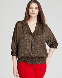 Luxe leopard print lends a touch of glamour to a feminine MICHAEL Michael Kors Plus blouse featuring a chic tie collar. Luxe leopard print lends a touch of glamour to a feminine MICHAEL Michael Kors Plus blouse featuring a chic tie collar.