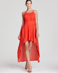 Make a dramatic entrance in this gorgeous Madison Marcus silk gown with flowing high-low hemline--the silhouette of the season. A small triangle cut-out adds to the allure of this look. Make a dramatic entrance in this gorgeous Madison Marcus silk gown with flowing high-low hemline--the silhouette of the season. A small triangle cut-out adds to the allure of this look.