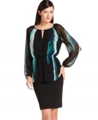 Calvin Klein's blouse features a flattering, peasant-inspired fit and a painterly print. Calvin Klein's blouse features a flattering, peasant-inspired fit and a painterly print.