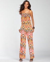 Whether you're wearing it as a cover-up or dressing it up with heels and sparkling jewelry, INC's exotic-print jumpsuit makes a surprisingly versatile addition to your wardrobe! Whether you're wearing it as a cover-up or dressing it up with heels and sparkling jewelry, INC's exotic-print jumpsuit makes a surprisingly versatile addition to your wardrobe!