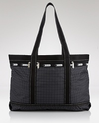 Cooly blending practical design with a fashionable feel, LeSportsac's printed nylon tote makes a smart travel companion. Cooly blending practical design with a fashionable feel, LeSportsac's printed nylon tote makes a smart travel companion.