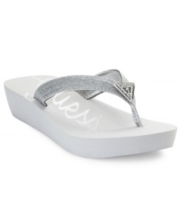 Sparkly straps are brightened even further with a rhinestone-embellished brand logo at the vamp. Guess's Sidan thong sandals are a great way to add glitz to your casual days. Sparkly straps are brightened even further with a rhinestone-embellished brand logo at the vamp. Guess's Sidan thong sandals are a great way to add glitz to your casual days.