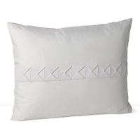 A lush, contrasting grosgrain ribbon, folded into textural squares, adds detail to this silk decorative pillow. A lush, contrasting grosgrain ribbon, folded into textural squares, adds detail to this silk decorative pillow.