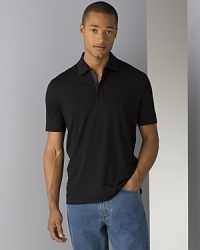 BOSS Black Verona zip polo. Short sleeved zip placket polo shirt. Wide hem on edge of sleeves and bottom of shirt. BOSS Black Verona zip polo. Short sleeved zip placket polo shirt. Wide hem on edge of sleeves and bottom of shirt.