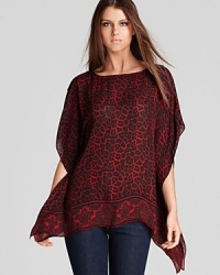 Crisp leopard print enlivens an ethereal MICHAEL Michael Kors top, finished with a contrast paisley border for spot-on style. Crisp leopard print enlivens an ethereal MICHAEL Michael Kors top, finished with a contrast paisley border for spot-on style.
