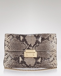 MICHAEL Michael Kors' embossed python clutch lends exotic appeal after hours. Dual purpose, this convertible bag is equally enticing over the shoulder or tucked under a LBD. MICHAEL Michael Kors' embossed python clutch lends exotic appeal after hours. Dual purpose, this convertible bag is equally enticing over the shoulder or tucked under a LBD.