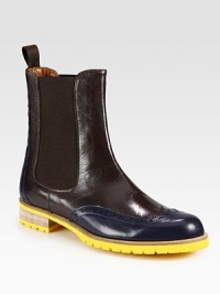 Easy-to-wear rainy weather staple of bicolor leather with wingtip detailing and a vibrant rubber sole. Stacked rubber and wooden heel, 1¼ (30mm)Leather upperBack pull-tab and side elastic goresLeather liningRubber trek solePadded insoleMade in ItalyOUR FIT MODEL RECOMMENDS ordering one half size up as this style runs small. Easy-to-wear rainy weather staple of bicolor leather with wingtip detailing and a vibrant rubber sole. Stacked rubber and wooden heel, 1¼ (30mm)Leather upperBack pull-tab and side elastic goresLeather liningRubber trek solePadded insoleMade in ItalyOUR FIT MODEL RECOMMENDS ordering one half size up as this style runs small.