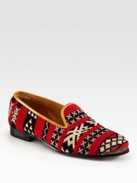 Expertly woven in a vivid pattern of rich hues, this cotton-wool blend trimmed with leather is perfect for relaxing days and nights. 40% cotton/35% wool/25% polyester upper with leather trimLeather lining and solePadded insoleImported Expertly woven in a vivid pattern of rich hues, this cotton-wool blend trimmed with leather is perfect for relaxing days and nights. 40% cotton/35% wool/25% polyester upper with leather trimLeather lining and solePadded insoleImported