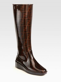 A lifted silhouette for rainy days made of signature logo-printed PVC. Rubber wedge, 1¾ (45mm)Shaft, 14¼Leg circumference, 14¼PVC upperLeather liningRubber solePadded insoleMade in Italy A lifted silhouette for rainy days made of signature logo-printed PVC. Rubber wedge, 1¾ (45mm)Shaft, 14¼Leg circumference, 14¼PVC upperLeather liningRubber solePadded insoleMade in Italy