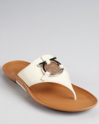 A casual classic gets dressed up with luxe leather and a shining gancini detail. From Salvatore Ferragamo. A casual classic gets dressed up with luxe leather and a shining gancini detail. From Salvatore Ferragamo.