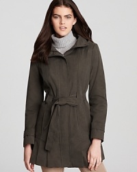 Stay dry--and full of style--in this Calvin Klein hooded raincoat. It's super lightweight and the collar is adjustable for added protection against the elements. Stay dry--and full of style--in this Calvin Klein hooded raincoat. It's super lightweight and the collar is adjustable for added protection against the elements.