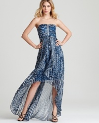 In a cool blue abstract print, Laundry by Shelli Segal's high-low hemmed dress makes waves in a strapless silhouette with beaded accents. In a cool blue abstract print, Laundry by Shelli Segal's high-low hemmed dress makes waves in a strapless silhouette with beaded accents.