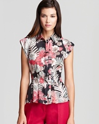 Flaunt vibrant style with this luxe silk Armani Collezioni shirt in a bold, of-the-moment tropical print. Flaunt vibrant style with this luxe silk Armani Collezioni shirt in a bold, of-the-moment tropical print.