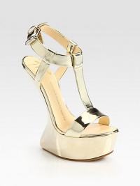 Glimmering metallic leather with a uniquely curved wedge, chunky platform and an adjustable t-strap. Self-covered wedge, 6 (150mm)Covered platform, 2 (50mm)Compares to a 4 heel (100mm)Metallic leather upperLeather liningBuffed leather solePadded insoleMade in ItalyThis style runs true to size. We recommend ordering your usual size for a standard fit. Glimmering metallic leather with a uniquely curved wedge, chunky platform and an adjustable t-strap. Self-covered wedge, 6 (150mm)Covered platform, 2 (50mm)Compares to a 4 heel (100mm)Metallic leather upperLeather liningBuffed leather solePadded insoleMade in ItalyThis style runs true to size. We recommend ordering your usual size for a standard fit.