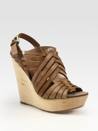 Earthy wooden wedge topped with a maze of buttery leather straps and an adjustable slingback. Wooden wedge, 5 (125mm)Wooden platform, 1 (25mm)Compares to a 4 heel (100mm)Leather upperLeather lining and solePadded insoleImported Earthy wooden wedge topped with a maze of buttery leather straps and an adjustable slingback. Wooden wedge, 5 (125mm)Wooden platform, 1 (25mm)Compares to a 4 heel (100mm)Leather upperLeather lining and solePadded insoleImported