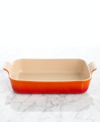 Straight from the oven to the table, this stoneware baker is built odor-, scratch- and stain-resistant, gracefully taking wear and tear in and out of the kitchen for a lifetime of use. The deep dish is ideal for lasagnas, casseroles and other layered entrees, but also offers more than function with a refined design and flared handles that give it centerpiece status. 5-year limited warranty. Straight from the oven to the table, this stoneware baker is built odor-, scratch- and stain-resistant, gracefully taking wear and tear in and out of the kitchen for a lifetime of use. The deep dish is ideal for lasagnas, casseroles and other layered entrees, but also offers more than function with a refined design and flared handles that give it centerpiece status. 5-year limited warranty.