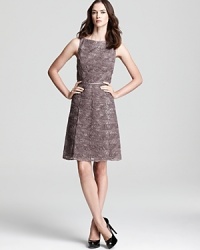 Tulle swirls lend texture to a sleeveless dress from Adrianna Papell, a classically ladylike option that looks effortless for both day and night. Tulle swirls lend texture to a sleeveless dress from Adrianna Papell, a classically ladylike option that looks effortless for both day and night.