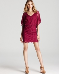 In a rich jewel tone hue, this Laundry by Shelli Segal dress is luxe in lace and low-key in a loose, blouson silhouette. In a rich jewel tone hue, this Laundry by Shelli Segal dress is luxe in lace and low-key in a loose, blouson silhouette.