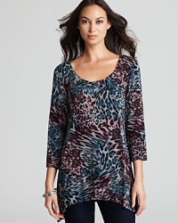 Lined with a seamless lockstitched shapewear tank to slim the figure, this Miraclebody by Miraclesuit tunic enlivens your everyday style with a graphic jolt of animal print.