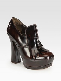 A sculpted banana heel and hidden platform heighten this leather staple with twin tassels. Self-covered heel, 5¼ (130mm)Hidden platform, 1¾ (45mm)Compares to a 3½ heel (90mm)Leather upperLeather liningLeather and rubber solePadded insoleMade in Italy A sculpted banana heel and hidden platform heighten this leather staple with twin tassels. Self-covered heel, 5¼ (130mm)Hidden platform, 1¾ (45mm)Compares to a 3½ heel (90mm)Leather upperLeather liningLeather and rubber solePadded insoleMade in Italy