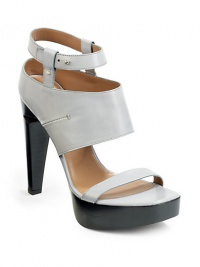 THE LOOKLeather top strapWide ankle cuff with side seamAdjustable ankle strap with stud closurePadded insoleNotched set-under heel, 5 (125mm)Stacked platform, 1 (25mm)Compares to a 4 heel (100mm)THE MATERIALCalf Leather upperLeather liningLeather and rubber soleORIGINMade in Italy THE LOOKLeather top strapWide ankle cuff with side seamAdjustable ankle strap with stud closurePadded insoleNotched set-under heel, 5 (125mm)Stacked platform, 1 (25mm)Compares to a 4 heel (100mm)THE MATERIALCalf Leather upperLeather liningLeather and rubber soleORIGINMade in Italy