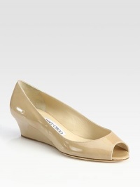 From the 24:7 Collection. Patent leather peep toe with a decent-sized wedge-- perfect for the office and beyond. Self-covered wedge, 1½ (40mm)Patent leather upperLeather liningBuffed leather solePadded insoleMade in ItalyOUR FIT MODEL RECOMMENDS ordering true whole size; ½ sizes should order the next whole size up. From the 24:7 Collection. Patent leather peep toe with a decent-sized wedge-- perfect for the office and beyond. Self-covered wedge, 1½ (40mm)Patent leather upperLeather liningBuffed leather solePadded insoleMade in ItalyOUR FIT MODEL RECOMMENDS ordering true whole size; ½ sizes should order the next whole size up.