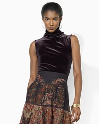A classic turtleneck is infused with vintage, feminine appeal, crafted in soft velvet with four brass buttons at the back neckline. A classic turtleneck is infused with vintage, feminine appeal, crafted in soft velvet with four brass buttons at the back neckline.