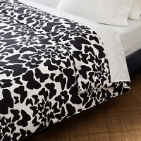 Butterflies, symbolic of freedom, naturalness and joyous times, are captured in flight on this duvet. In black on a field of white, their flutters inspire creative combinations and tranquil transitions into the dream world. Butterflies, symbolic of freedom, naturalness and joyous times, are captured in flight on this duvet. In black on a field of white, their flutters inspire creative combinations and tranquil transitions into the dream world.