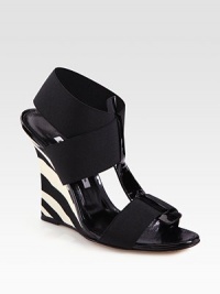 Zebra-printed leather wedge with comfortable elastic straps and a subtle patent leather t-strap. Self-covered heel, 4 (100mm)Elastic and patent leather upperLeather liningBuffed leather solePadded insoleMade in ItalyOUR FIT MODEL RECOMMENDS ordering one half size up as this style runs small. Zebra-printed leather wedge with comfortable elastic straps and a subtle patent leather t-strap. Self-covered heel, 4 (100mm)Elastic and patent leather upperLeather liningBuffed leather solePadded insoleMade in ItalyOUR FIT MODEL RECOMMENDS ordering one half size up as this style runs small.