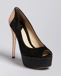 Bold, mixed-media design sets these B Brian Atwood platform pumps apart, set on a standout, snake-embossed metallic heel. A woven platform adds textural appeal. Bold, mixed-media design sets these B Brian Atwood platform pumps apart, set on a standout, snake-embossed metallic heel. A woven platform adds textural appeal.