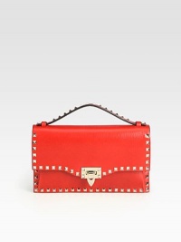 An edgy style with extreme elegance in luxurious leather and accented with pyramid studs.Top handle, 2 dropFlip-lock flap closureOne inside open pocketCotton lining11W X 6H X 1½DMade in Italy An edgy style with extreme elegance in luxurious leather and accented with pyramid studs.Top handle, 2 dropFlip-lock flap closureOne inside open pocketCotton lining11W X 6H X 1½DMade in Italy