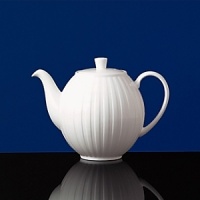 Simple shapes of crisp white are accented with precisely etched lines. Contrasting black matte jasper accessories with glazed interiors are also available. Bone china. Simple shapes of crisp white are accented with precisely etched lines. Contrasting black matte jasper accessories with glazed interiors are also available. Bone china.