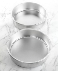 Two cake pans present your kitchen with endless possibilities... all delicious. Create a decadent layer cake or serve each cake individually-either way compliments to the chef will abound. The extra high sides let you bake taller cakes and cut mess to a minimum. Lifetime limited warranty. Two cake pans present your kitchen with endless possibilities... all delicious. Create a decadent layer cake or serve each cake individually-either way compliments to the chef will abound. The extra high sides let you bake taller cakes and cut mess to a minimum. Lifetime limited warranty.