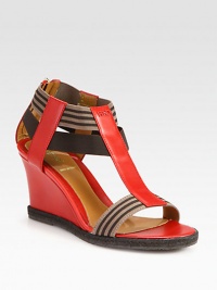 Leather wedge design with elasticized bands, textured espadrille trim and a signature logo detail. Leather-covered wedge with rope edging, 2¾ (70mm)Leather and elastic upperBack zipLeather lining and solePadded insoleMade in Italy Leather wedge design with elasticized bands, textured espadrille trim and a signature logo detail. Leather-covered wedge with rope edging, 2¾ (70mm)Leather and elastic upperBack zipLeather lining and solePadded insoleMade in Italy