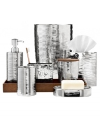 A defined sleek and modern design, this Hammered Metal toothbrush holder embodies a shining stainless steel construction with a textured finish for a luxe presentation. A defined sleek and modern design, this Hammered Metal toothbrush holder embodies a shining stainless steel construction with a textured finish for a luxe presentation.