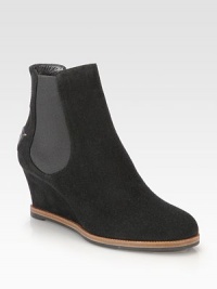 A leather logo detail completes this comfortable wedge silhouette of fine Italian suede. Self-covered wedge, 2¾ (70mm)Suede upper with elastic panels and leather accentLeather liningRubber solePadded insoleMade in Italy A leather logo detail completes this comfortable wedge silhouette of fine Italian suede. Self-covered wedge, 2¾ (70mm)Suede upper with elastic panels and leather accentLeather liningRubber solePadded insoleMade in Italy