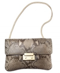 Reach for this reptilian print silhouette from MICHAEL Michael Kors and delight in its diva-worthy design. Sumptuous leather is adorned with signature golden hardware, while the compact interior discretely stows your evening essentials. Reach for this reptilian print silhouette from MICHAEL Michael Kors and delight in its diva-worthy design. Sumptuous leather is adorned with signature golden hardware, while the compact interior discretely stows your evening essentials.