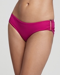 The rich cerise hue of this Zimmermann bikini bottom is the perfect compliment to a sought-after summer tan. The rich cerise hue of this Zimmermann bikini bottom is the perfect compliment to a sought-after summer tan.