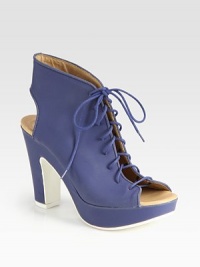 Ankle-grazing leather platform with a lace-up front, peep toe and an open back. Self-covered heel, 4 (100mm)Covered platform, 1 (25mm)Compares to a 3 heel (75mm)Leather upperLeather liningRubber solePadded insoleImportedOUR FIT MODEL RECOMMENDS ordering true size. Ankle-grazing leather platform with a lace-up front, peep toe and an open back. Self-covered heel, 4 (100mm)Covered platform, 1 (25mm)Compares to a 3 heel (75mm)Leather upperLeather liningRubber solePadded insoleImportedOUR FIT MODEL RECOMMENDS ordering true size.