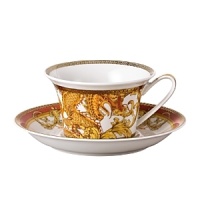The most legendary figure of Asian mythology, the red dragon rises majestically from this fabulously opulent dinnerware from Rosenthal Meets Versace, conveying all its might and glory. Each piece features ornate golden baroque patterns and four small medallions representing the sun, and the Versace medusa decorates the background. The most legendary figure of Asian mythology, the red dragon rises majestically from this fabulously opulent dinnerware from Rosenthal Meets Versace, conveying all its might and glory. Each piece features ornate golden baroque patterns and four small medallions representing the sun, and the Versace medusa decorates the background.